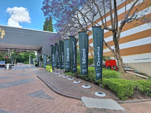 Outdoor WHX World Health Expo feather flags including Johannesburg